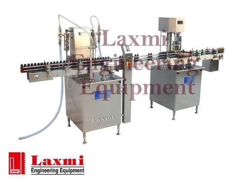 Head Filling with Manual Capplacement & Automatic Capping